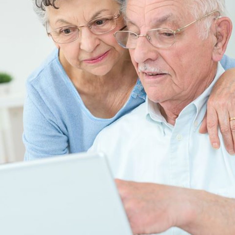 older-couple-surfing-the-web-PBVV835
